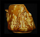 Thumbnail image of a rebekah at the Well teapot in a Rockingham glaze - click on image and it takes you to the introduction page of the Rockingham Ware ceramics.
